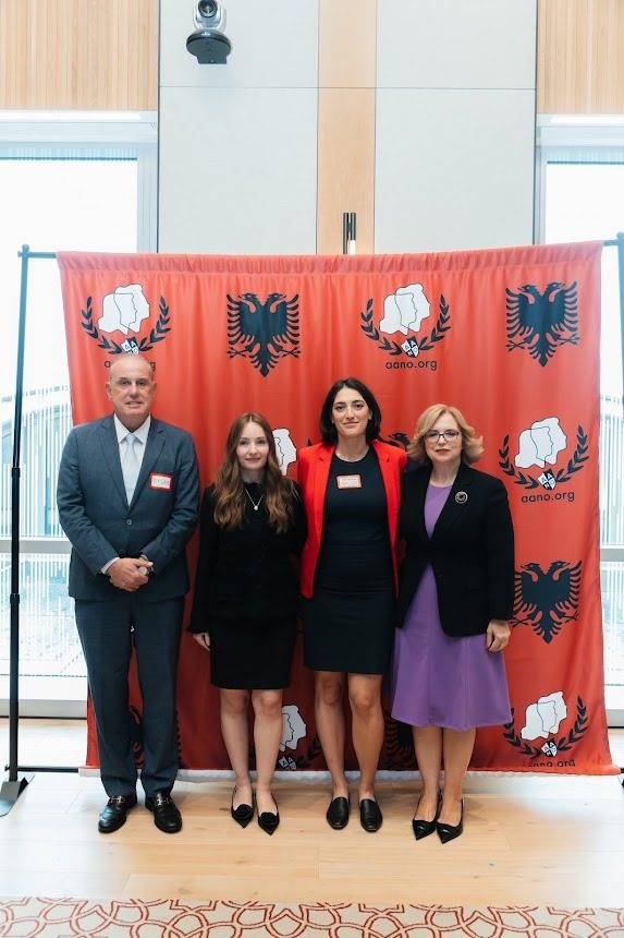 Law and civic leadership panelists in front of the AANO backdrop.