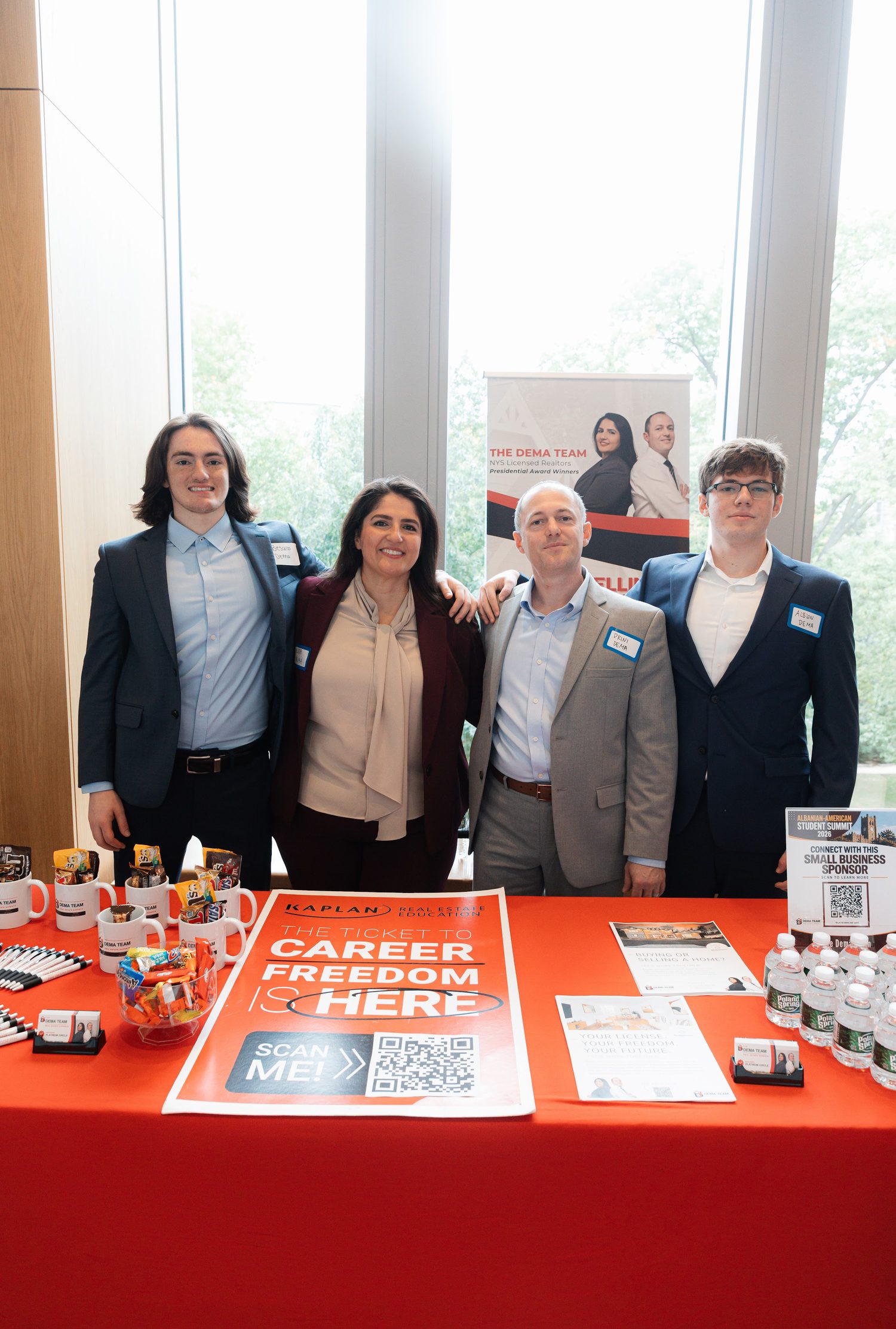 Sponsor representatives behind a recruiting table set up for students.