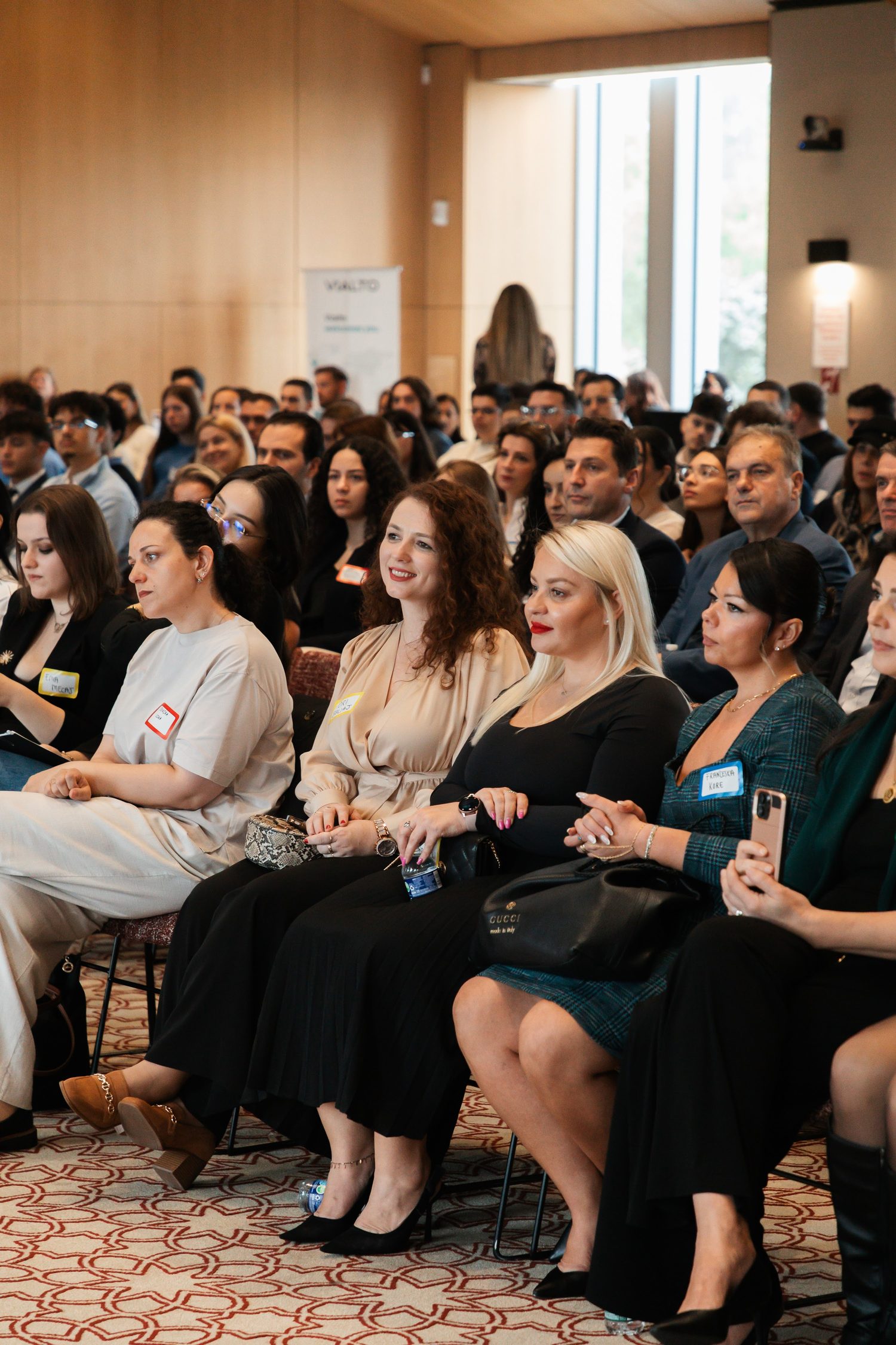 Attendees listening from the audience during a panel.