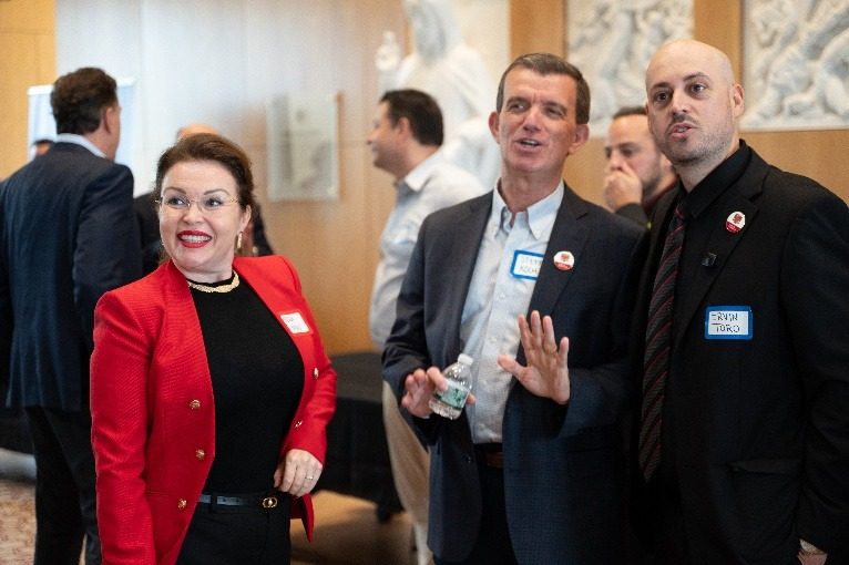 Attendees talking during the reception.