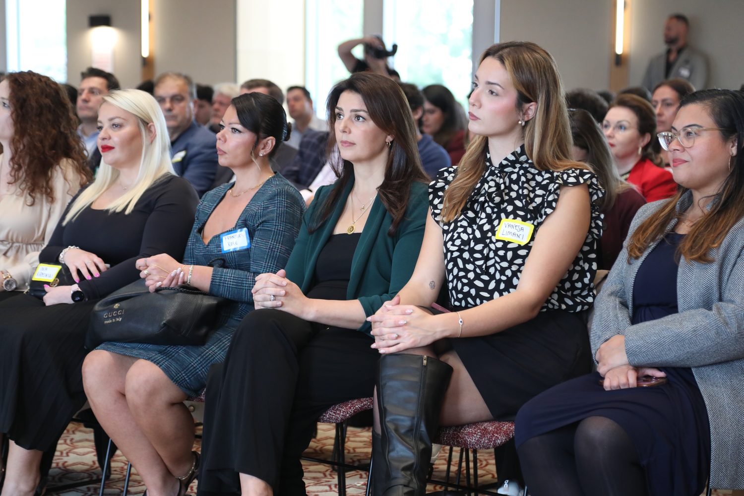 Attendees seated and listening during a panel.